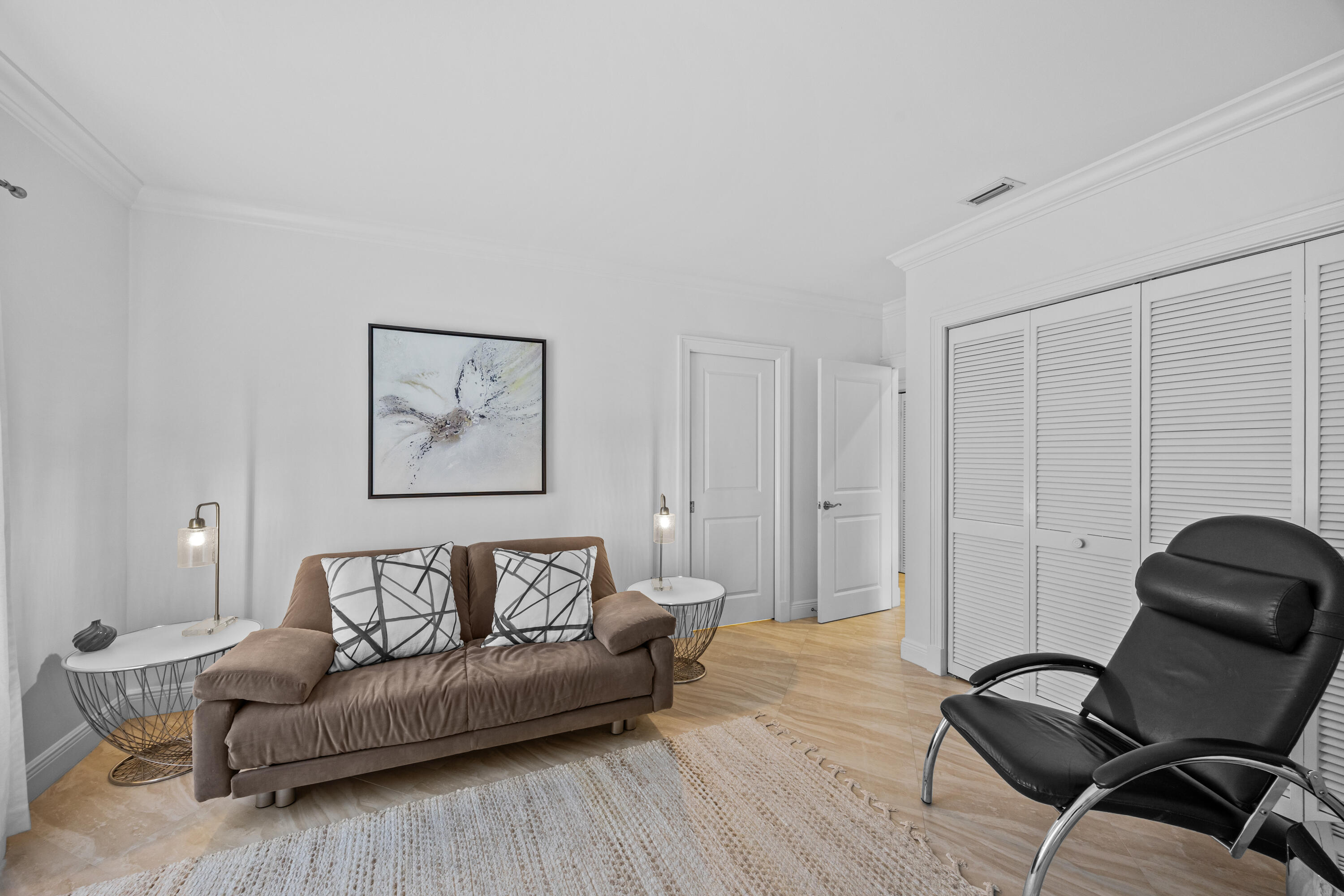 13254 Polo Club Road, Unit C204 Wellington, FL 33414 - Photo 27 of 29 a living room with furniture and a wooden floor