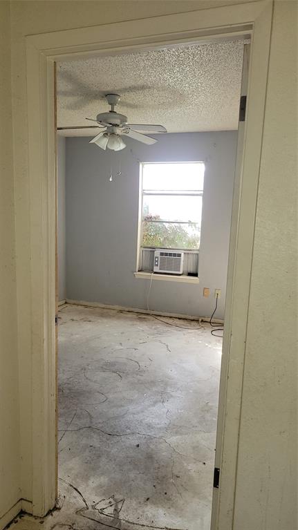 902 South Old Temple Road Hewitt, TX 76643 - Photo 9 of 32 Room featuring a window, light gray painted walls, and a ceiling fan