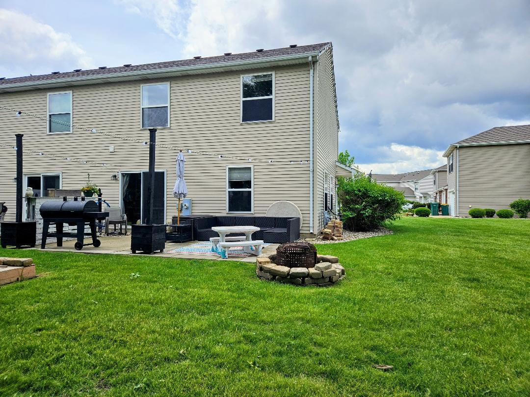 25159 Faraday Road Manhattan, IL 60442 - Photo 28 of 28 a view of a house with backyard sitting area and garden
