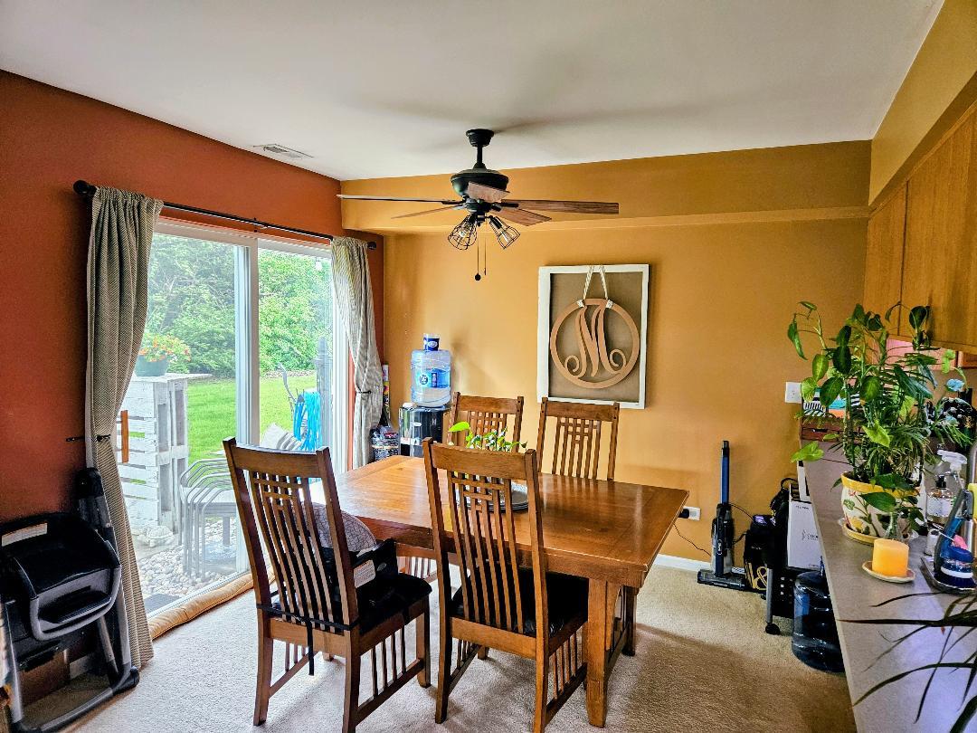 25159 Faraday Road Manhattan, IL 60442 - Photo 3 of 28 a view of a dining room with furniture window and outside view