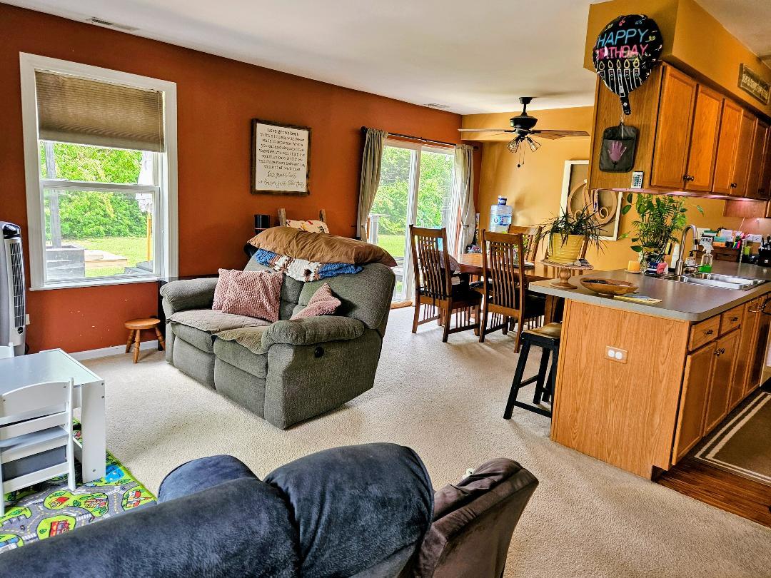 25159 Faraday Road Manhattan, IL 60442 - Photo 4 of 28 a living room with furniture and a large window