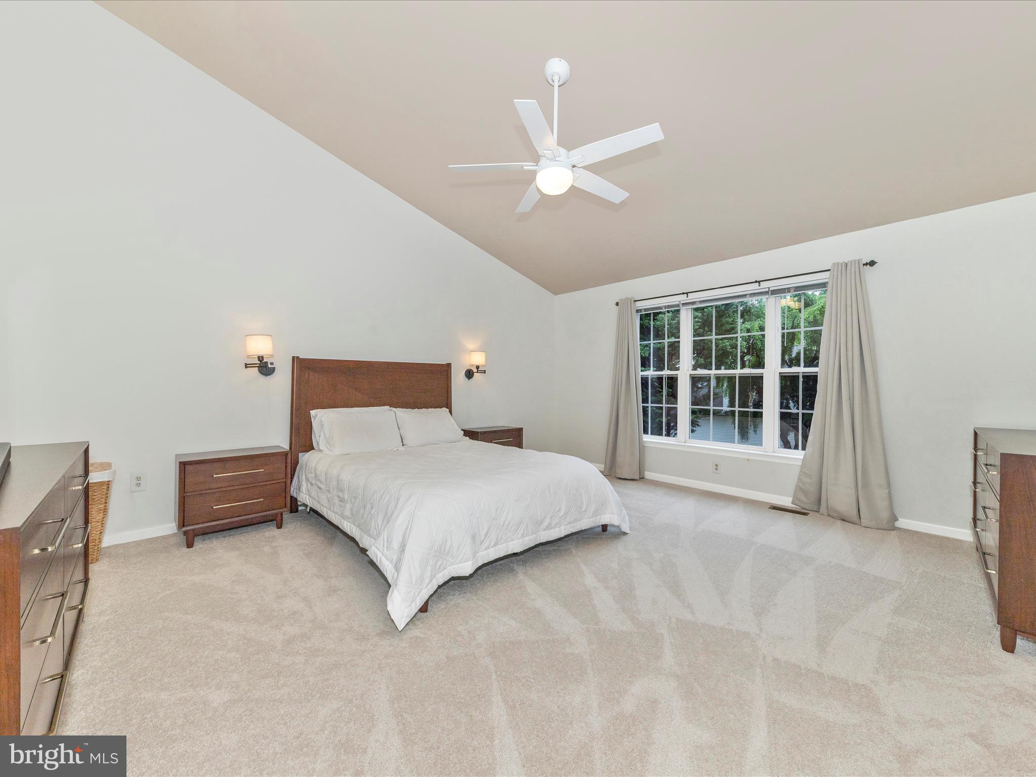 9034 Allington Manor Circle West Frederick, MD 21703 - Photo 18 of 55 a spacious bedroom with a bed and a window