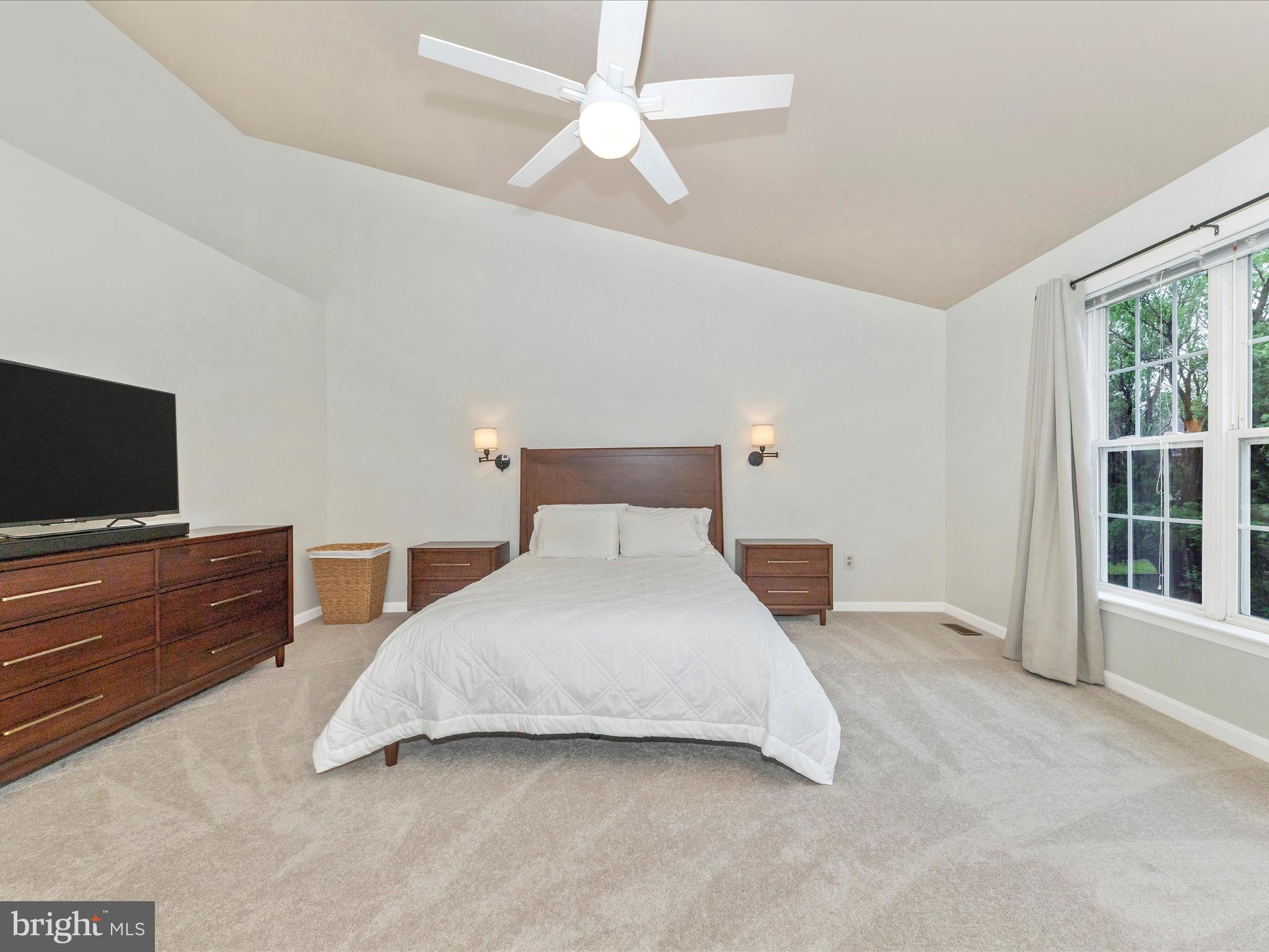 9034 Allington Manor Circle West Frederick, MD 21703 - Photo 19 of 55 a bedroom with a bed and a flat screen tv