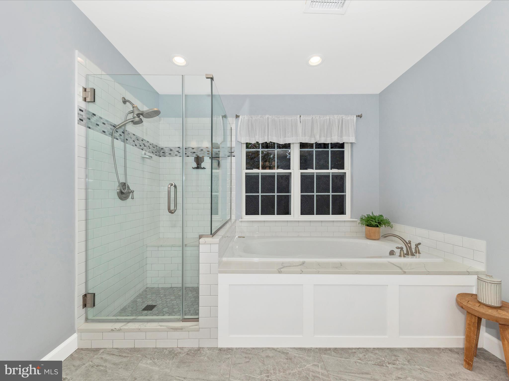 9034 Allington Manor Circle West Frederick, MD 21703 - Photo 22 of 55 a bathroom with a bathtub and a shower