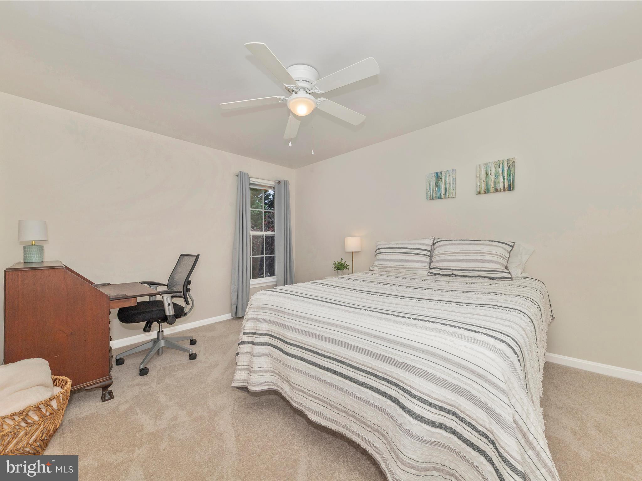 9034 Allington Manor Circle West Frederick, MD 21703 - Photo 23 of 55 a bedroom with a bed and a chair