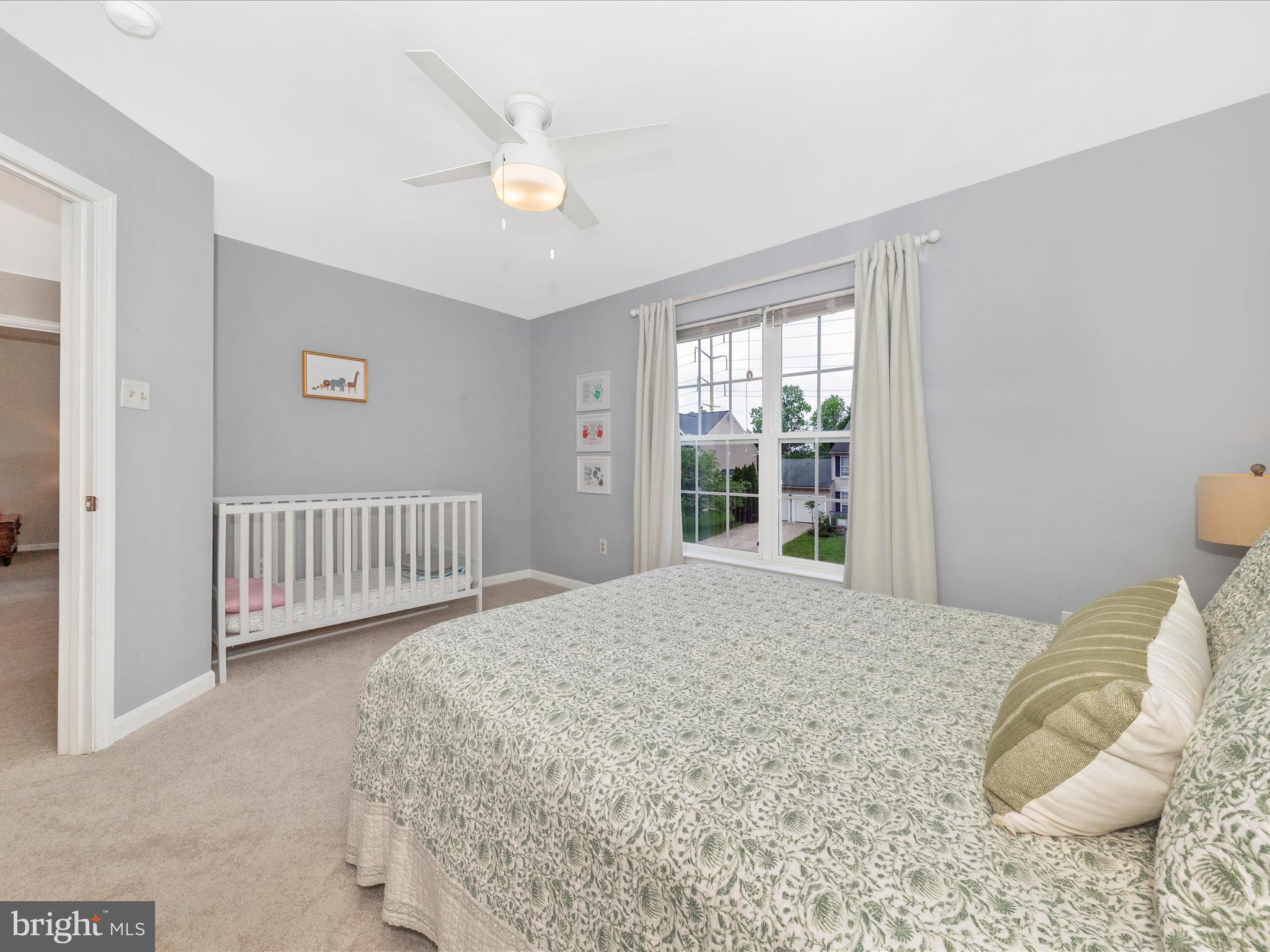 9034 Allington Manor Circle West Frederick, MD 21703 - Photo 32 of 55 a bedroom with a bed and a window