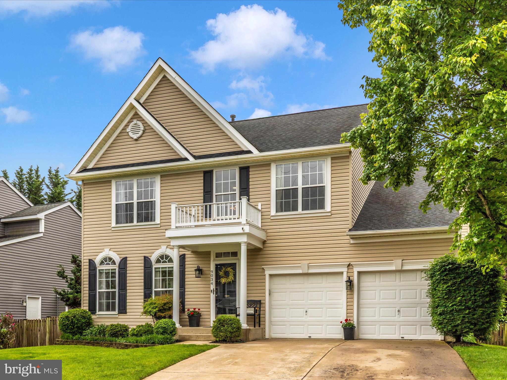 9034 Allington Manor Circle West Frederick, MD 21703 - Photo 54 of 55 a front view of a house with a yard and garage