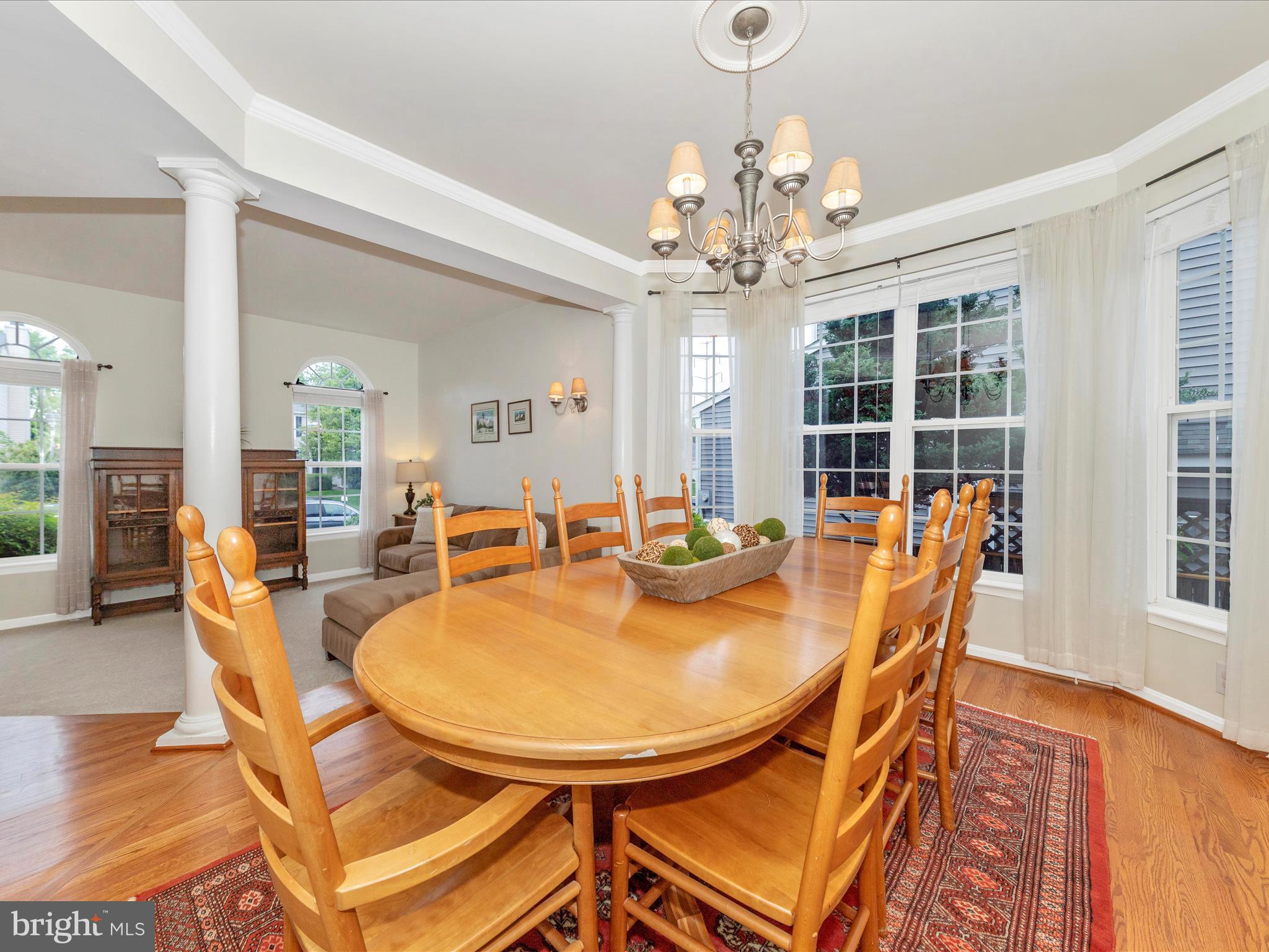 9034 Allington Manor Circle West Frederick, MD 21703 - Photo 6 of 55 a dining room with furniture a chandelier and wooden floor
