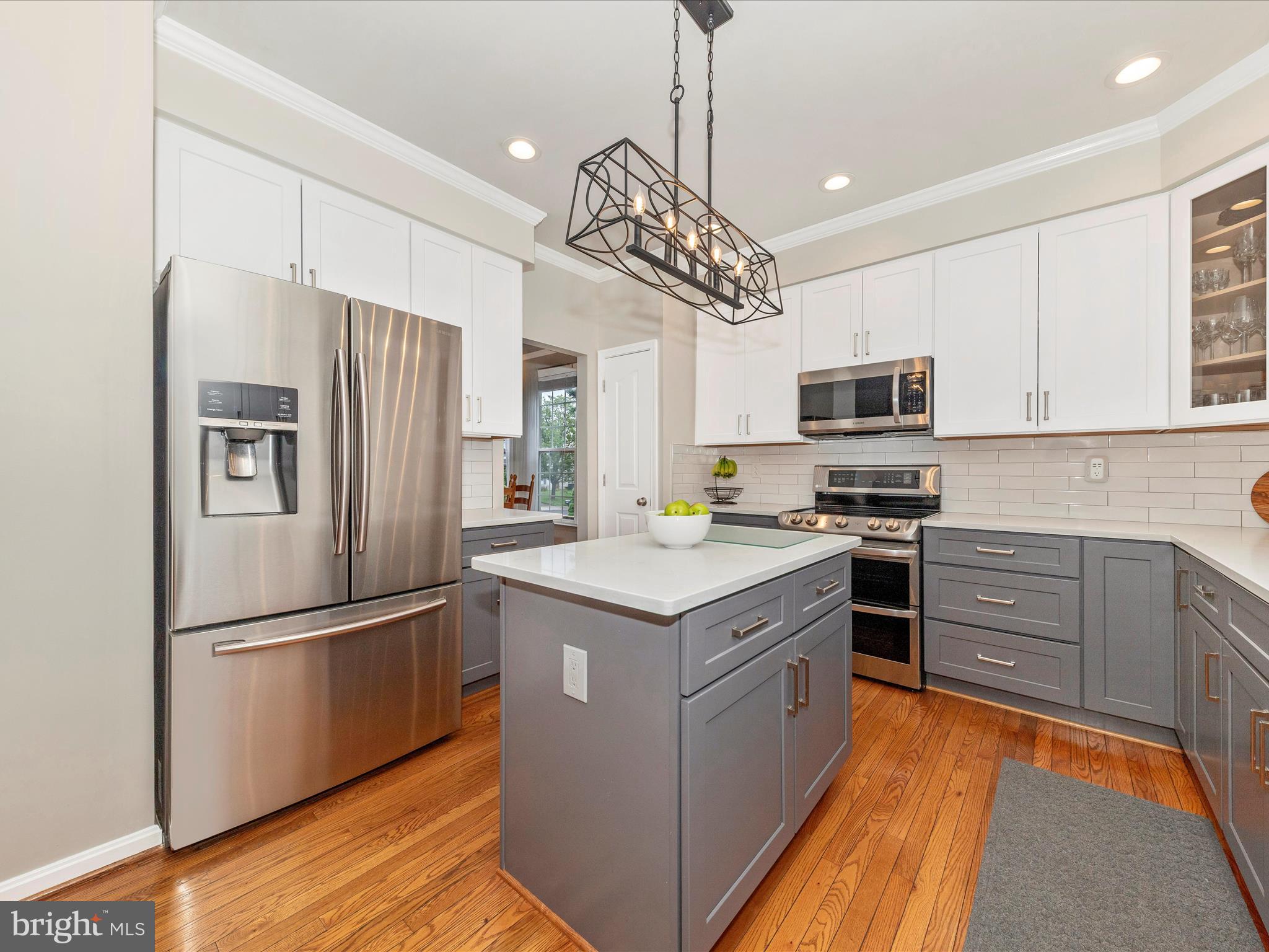 9034 Allington Manor Circle West Frederick, MD 21703 - Photo 9 of 55 a kitchen with kitchen island granite countertop stainless steel appliances cabinets a sink and a center
