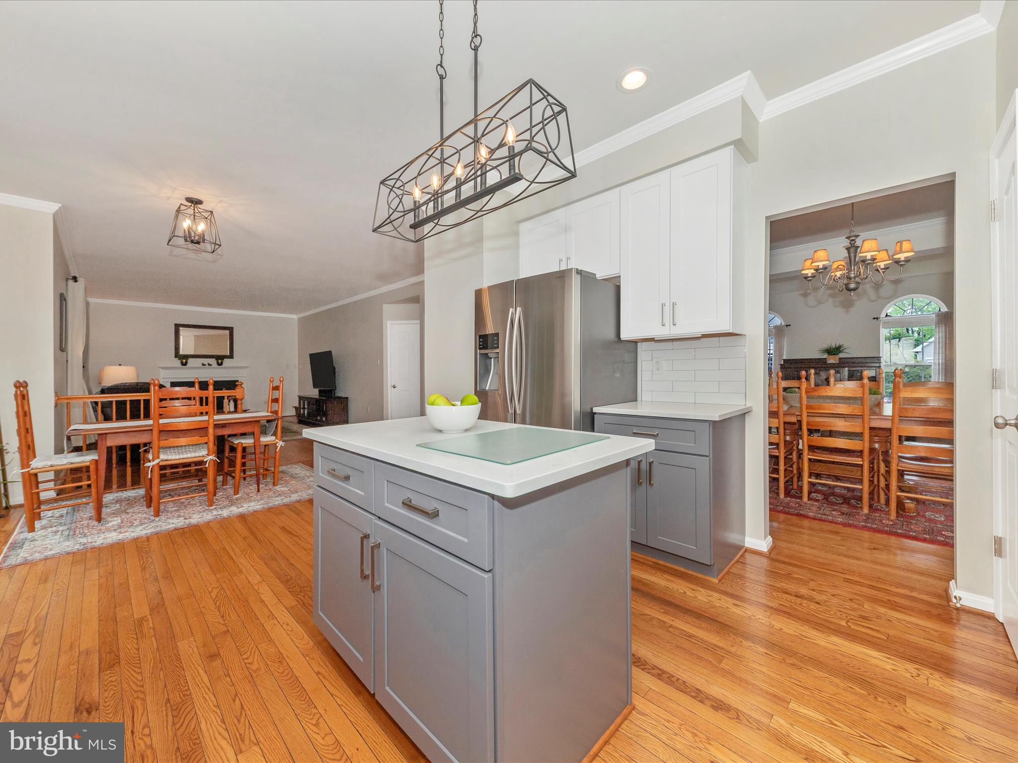 9034 Allington Manor Circle West Frederick, MD 21703 - Photo 10 of 55 a kitchen that has a lot of cabinets a sink and a wooden floor