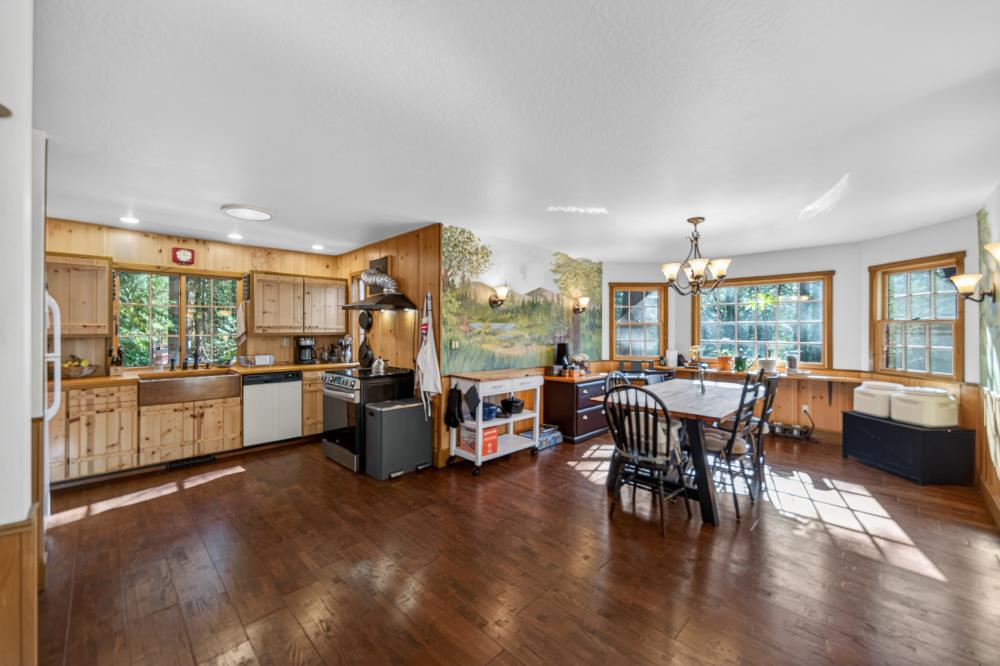 13052 Wood Rose Way Grass Valley, CA 95945 - Photo 11 of 46 a large kitchen with a table and chairs