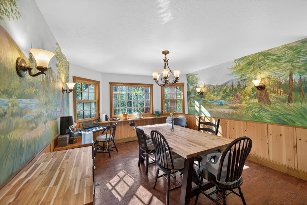 13052 Wood Rose Way Grass Valley, CA 95945 - Photo 14 of 46 a view of a dining room with furniture wooden floor and chandelier