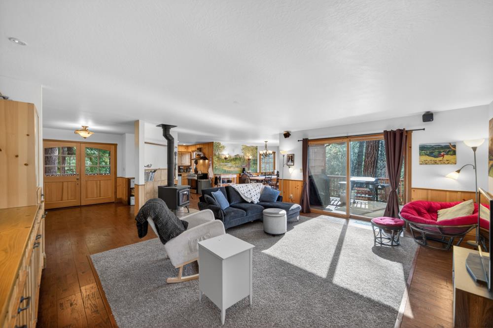13052 Wood Rose Way Grass Valley, CA 95945 - Photo 17 of 46 a living room with furniture window and wooden floor