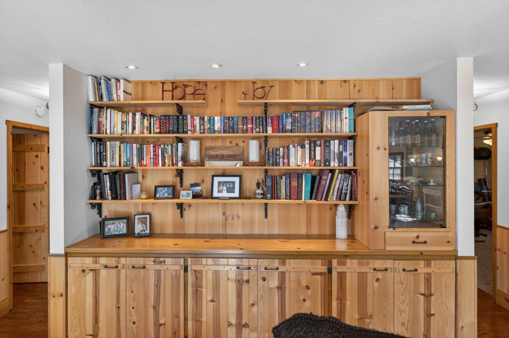 13052 Wood Rose Way Grass Valley, CA 95945 - Photo 18 of 46 a living room with furniture and book shelf