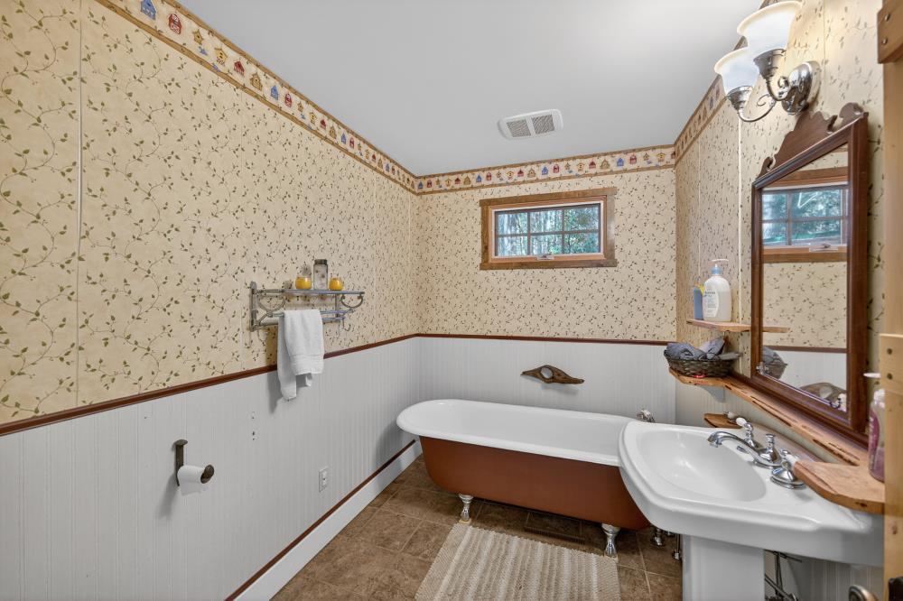 13052 Wood Rose Way Grass Valley, CA 95945 - Photo 20 of 46 a bathroom with a sink and a mirror