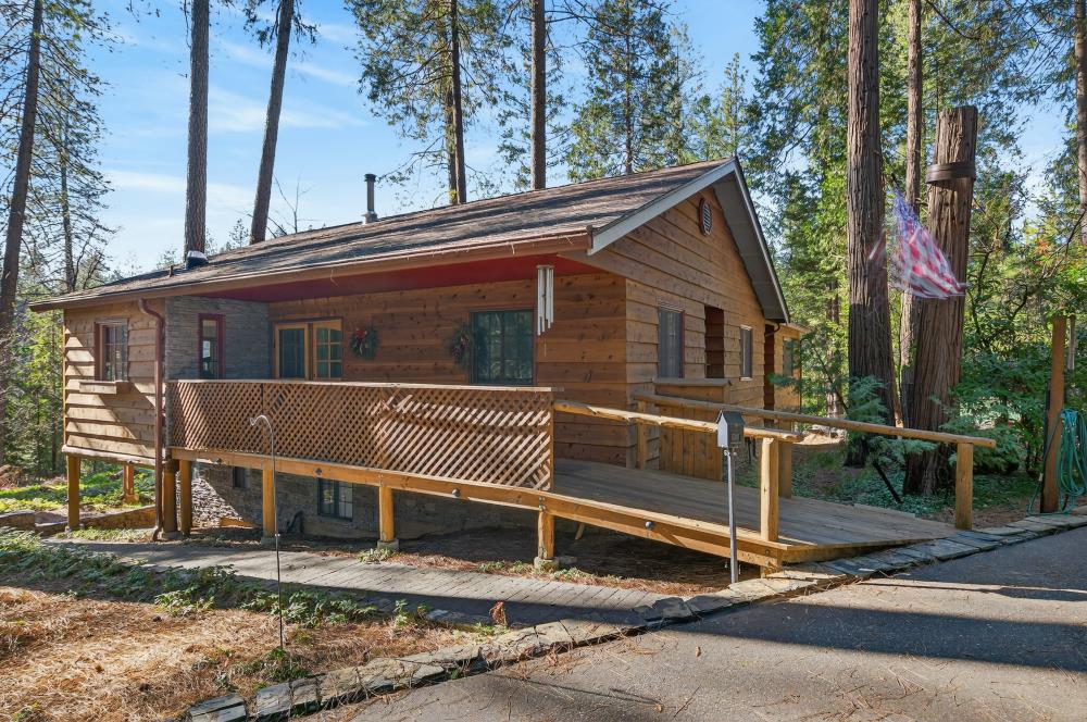 13052 Wood Rose Way Grass Valley, CA 95945 - Photo 2 of 46 a house view with a backyard space