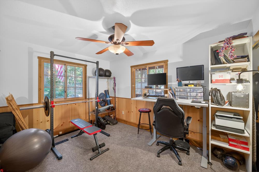 13052 Wood Rose Way Grass Valley, CA 95945 - Photo 22 of 46 a view of a workspace with furniture and a window
