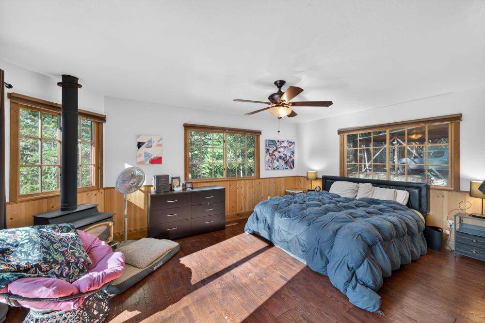13052 Wood Rose Way Grass Valley, CA 95945 - Photo 23 of 46 a living room with a bed furniture and a window