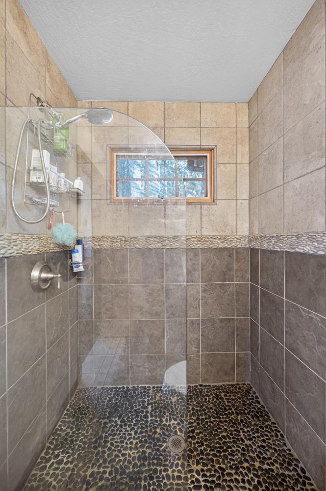 13052 Wood Rose Way Grass Valley, CA 95945 - Photo 26 of 46 a bathroom with a shower