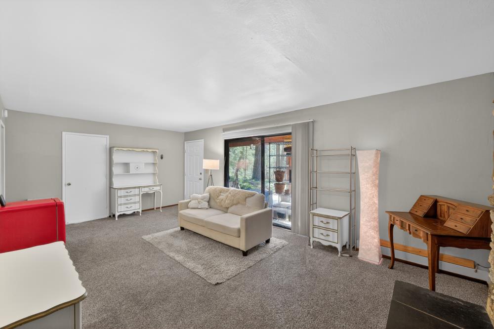 13052 Wood Rose Way Grass Valley, CA 95945 - Photo 31 of 46 a living room with furniture and a window