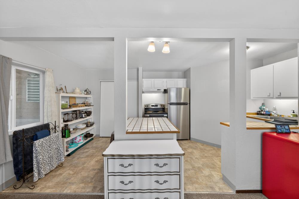 13052 Wood Rose Way Grass Valley, CA 95945 - Photo 32 of 46 a kitchen with stainless steel appliances granite countertop a stove and a refrigerator