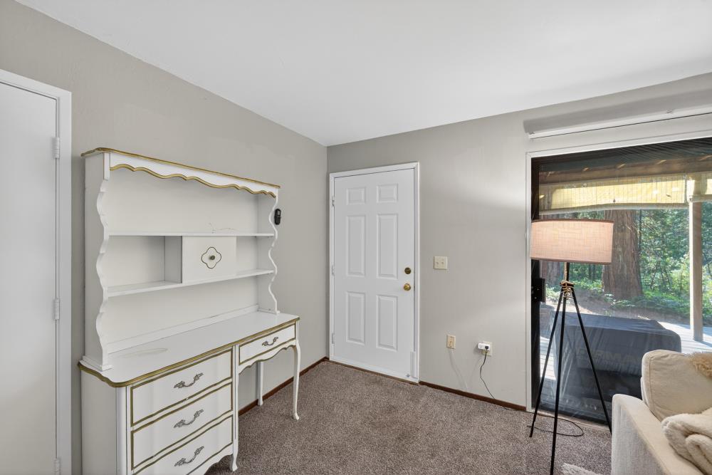 13052 Wood Rose Way Grass Valley, CA 95945 - Photo 35 of 46 a room with white cabinets and wooden floor