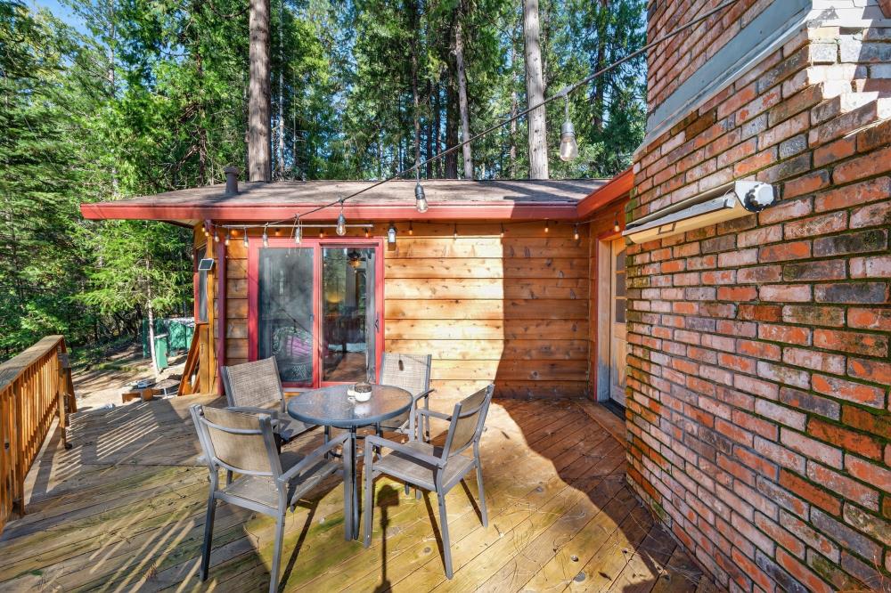 13052 Wood Rose Way Grass Valley, CA 95945 - Photo 40 of 46 a patio with glass top table and chairs