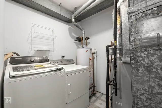 a view of a house with backyard and a tree