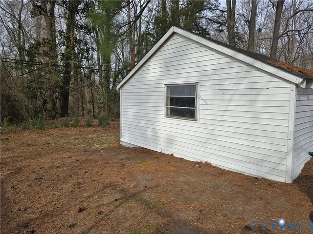 a view of a backyard of the house