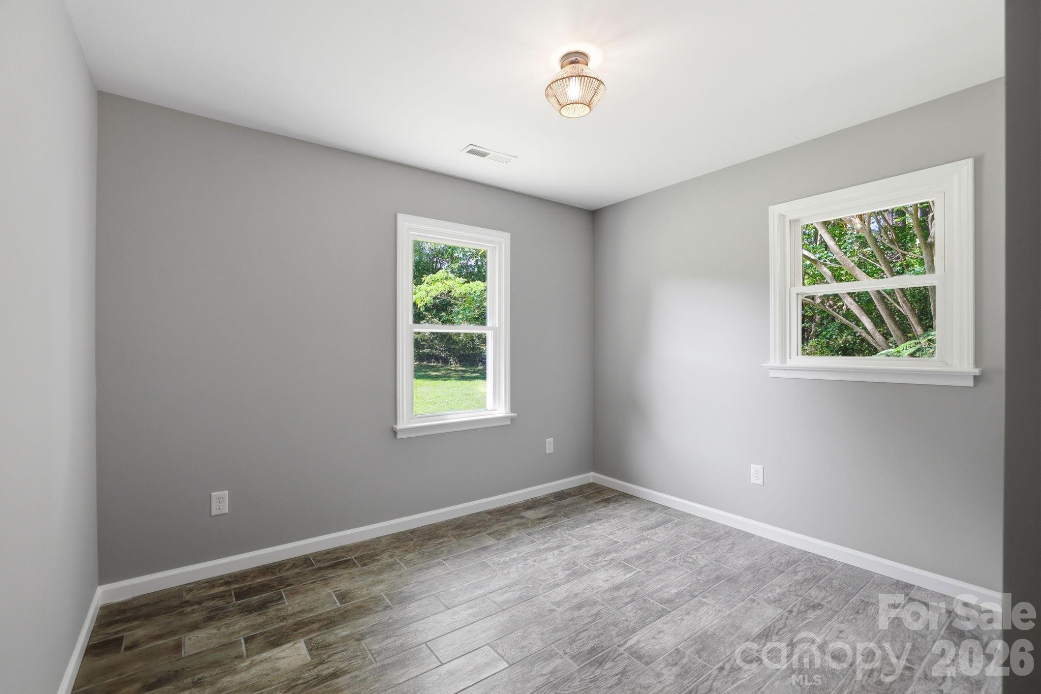 1108 Willoughby Road Monroe, NC 28110 - Photo 12 of 48 an empty room with a window