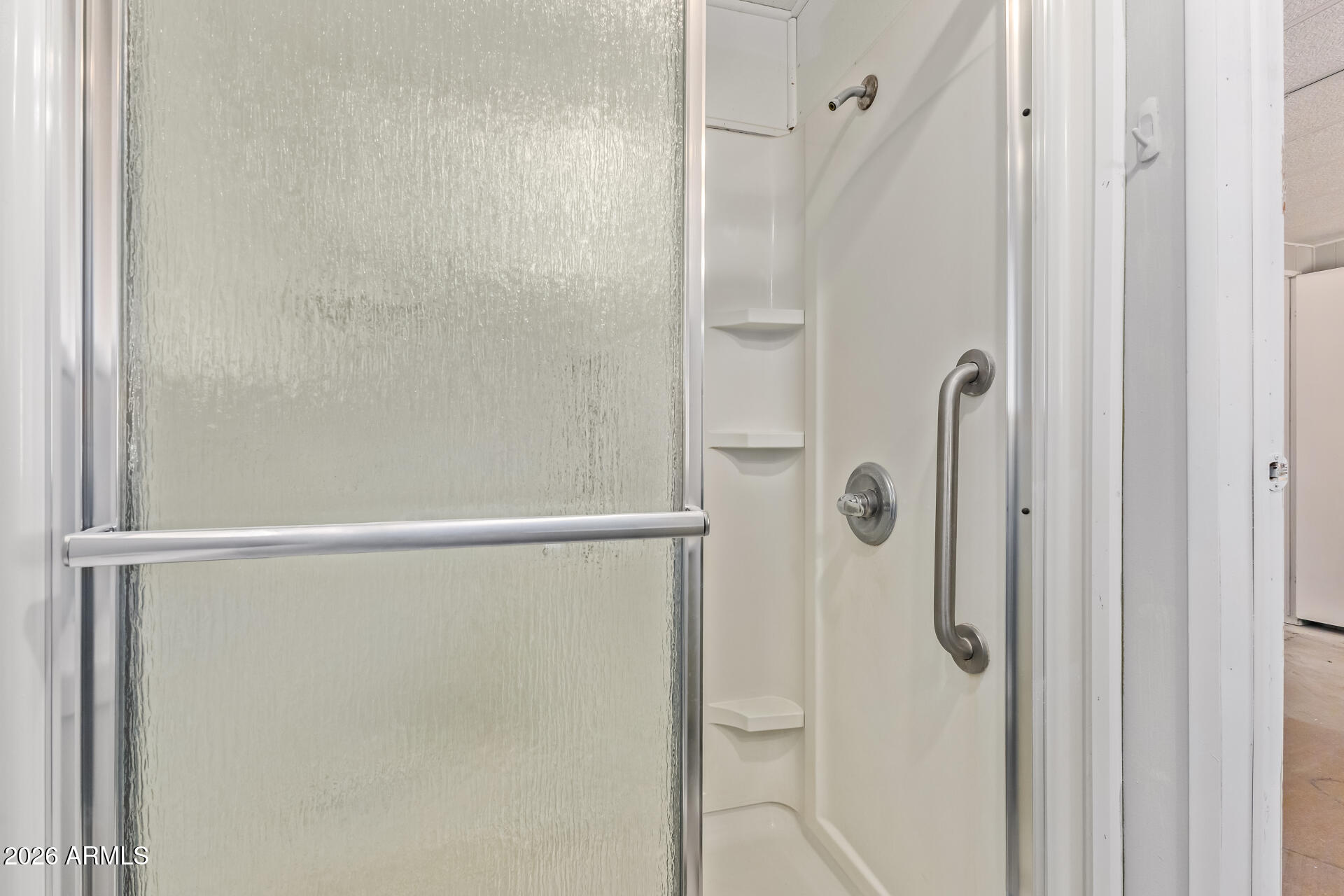 3104 East Broadway Road, Unit 76 Mesa, AZ 85204 - Photo 14 of 26 a bathroom with a glass shower door