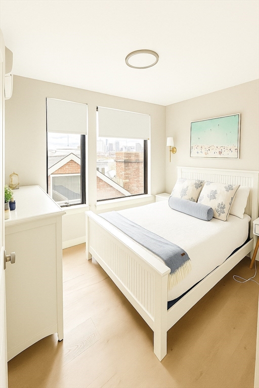 400 West Broadway, Unit 505 Boston, MA 02127 - Photo 12 of 18 a bedroom with a bed and a large window