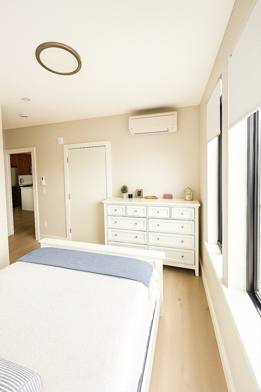 400 West Broadway, Unit 505 Boston, MA 02127 - Photo 13 of 18 a room with a bed and cabinets