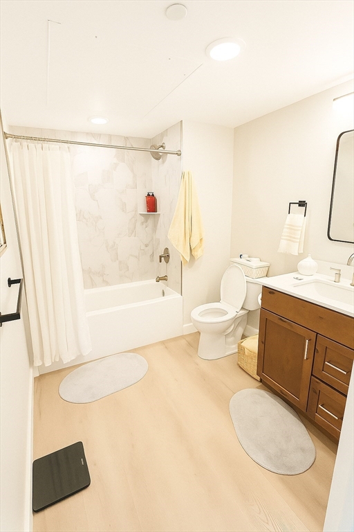 400 West Broadway, Unit 505 Boston, MA 02127 - Photo 9 of 18 a bathroom with a sink a toilet and shower