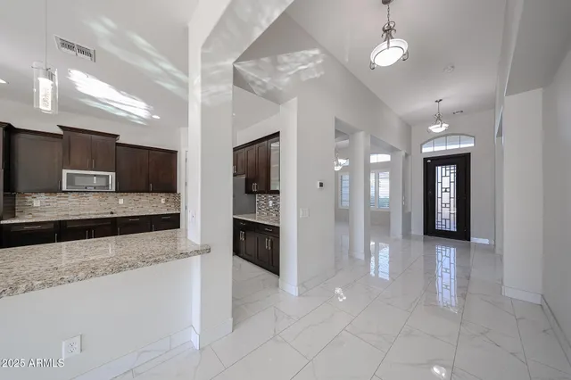 a large bathroom with a large tub and sink