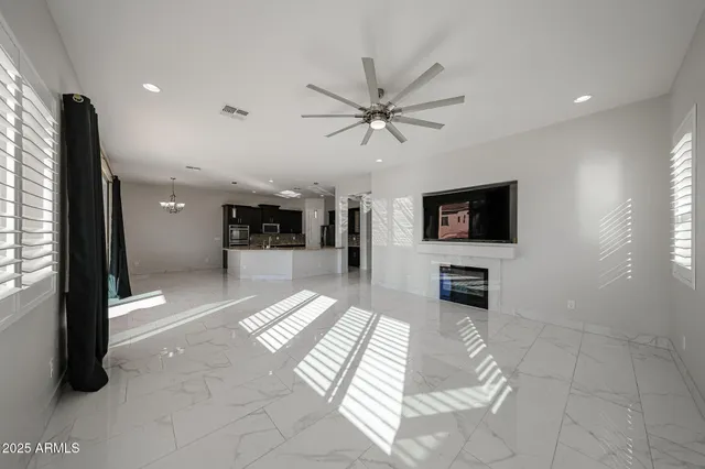 a view of a lobby with furniture and a flat screen tv