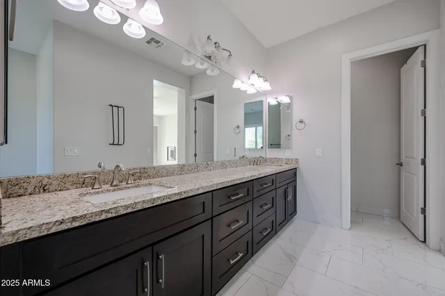 a bathroom with a window and a shower