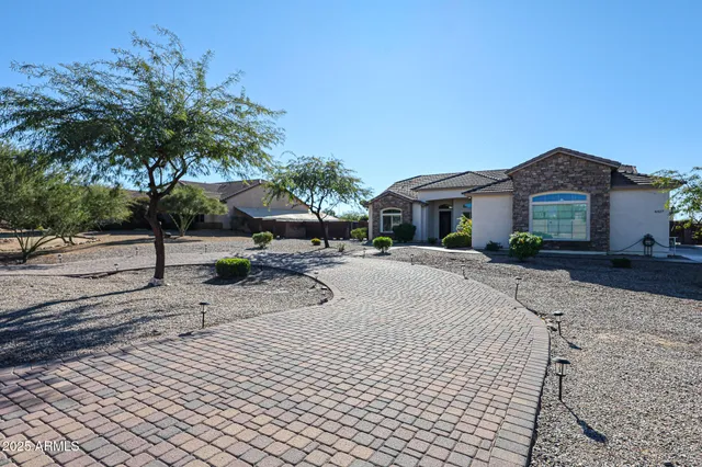 a house with palm tree in front of it