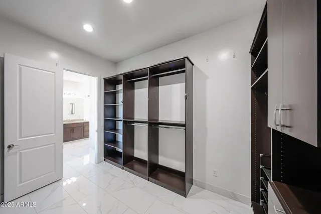 a view of an empty room with a fireplace