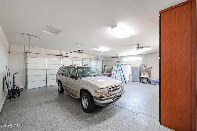 a view of a blue kitchen with white walls