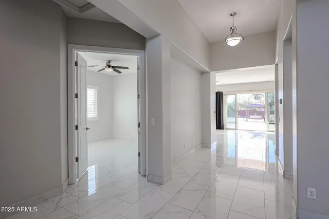 a bathroom with a glass door shower and a sink