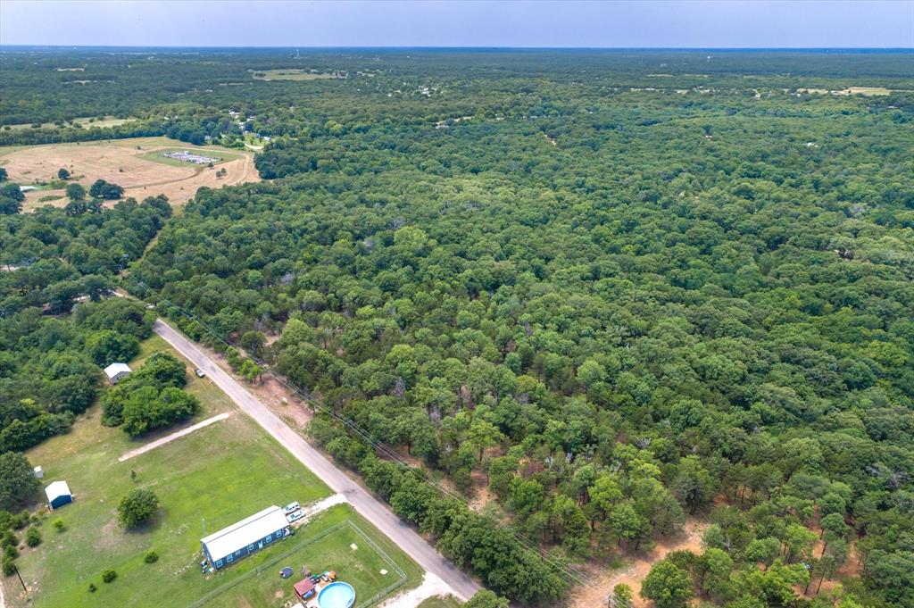 4423 County Road 3706 Wills Point, TX 75169 - Photo 8 of 13 a view of a field with an ocean view