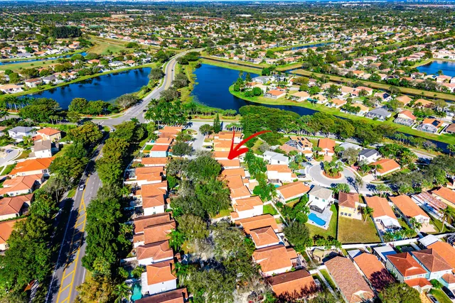 an aerial view of residential houses with outdoor space