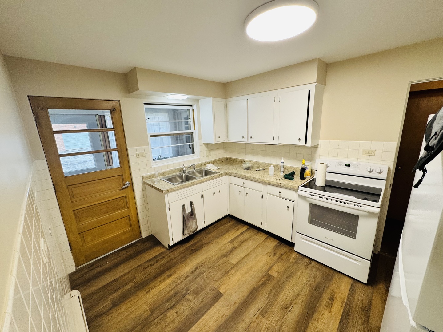 1009 Victoria, Unit 1N Antioch, IL 60002 - Photo 5 of 7 a view of kitchen with wooden floor and electronic appliances