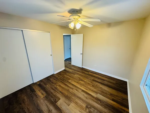 a view of room with wooden floor
