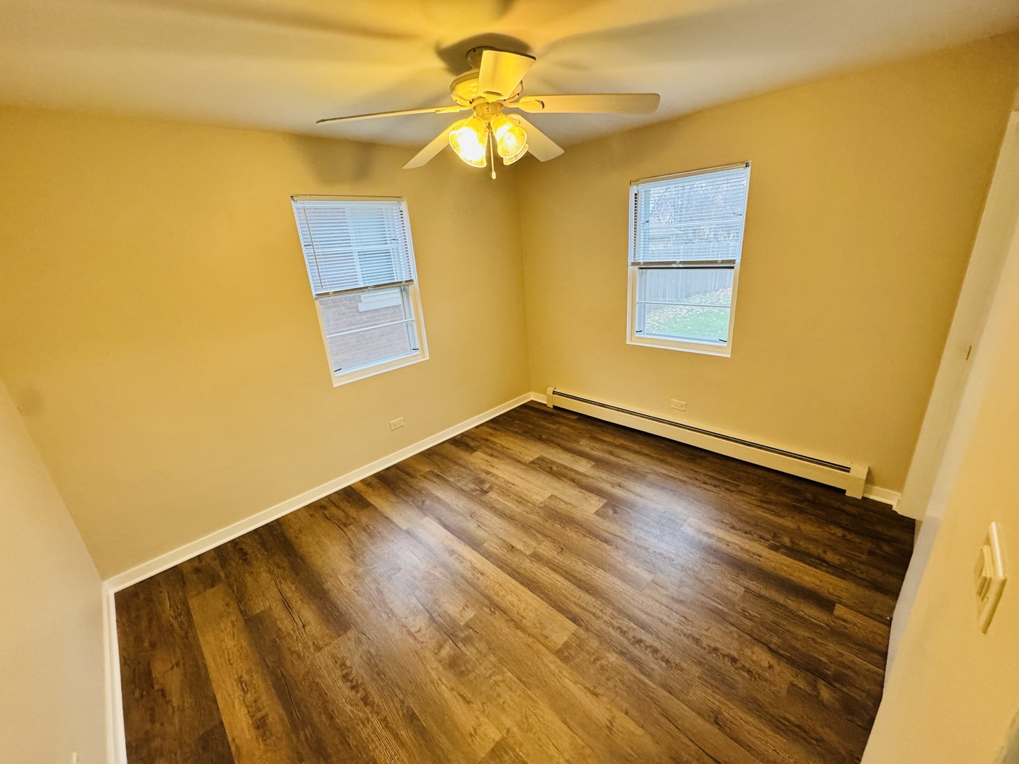 1009 Victoria, Unit 1N Antioch, IL 60002 - Photo 7 of 7 a view of an empty room with window and wooden floor