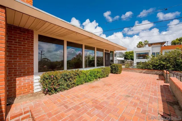 a view of a building with a yard