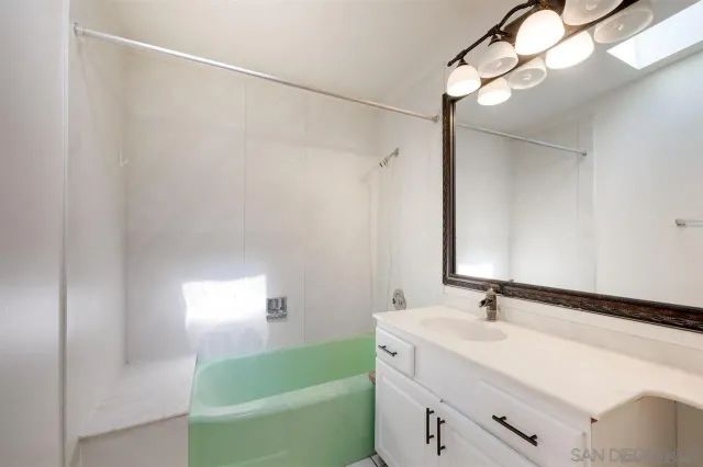 a kitchen with stainless steel appliances granite countertop a stove and a microwave