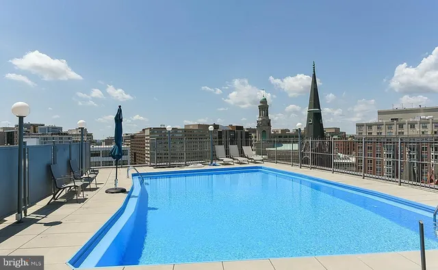 a view of a swimming pool with a terrace