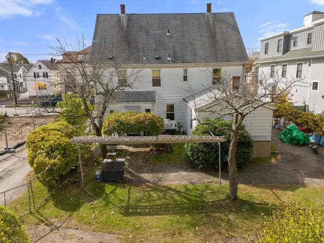 a aerial view of a house with swimming pool